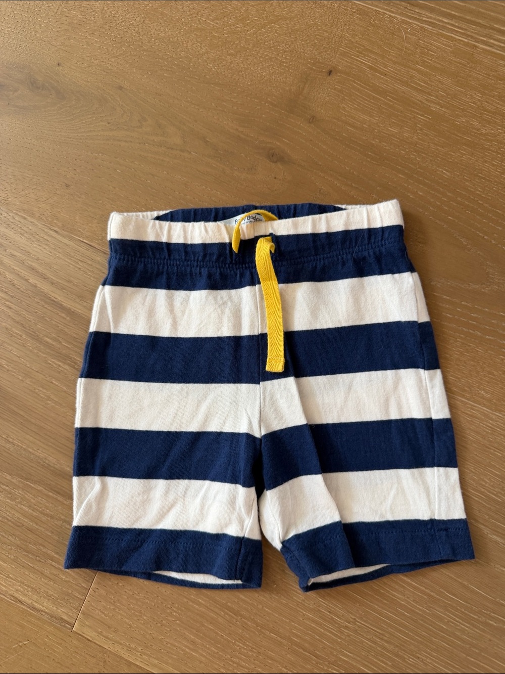 Baby Boden Navy and White Striped Shorts with Yellow Drawstring